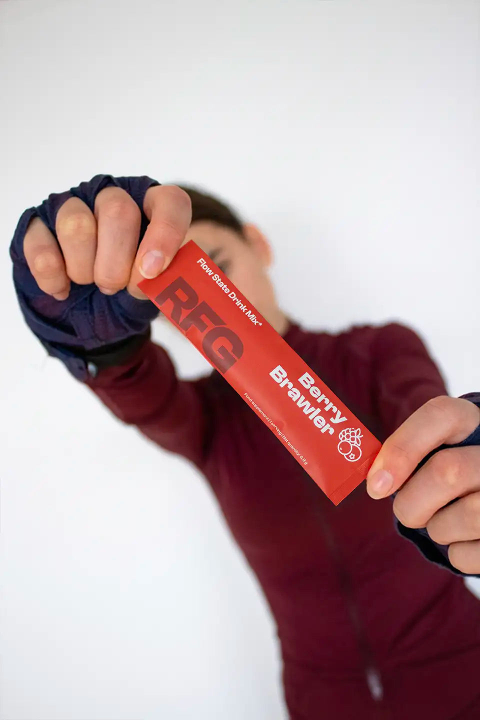 Athlete holding RFG Flow State Stick before training