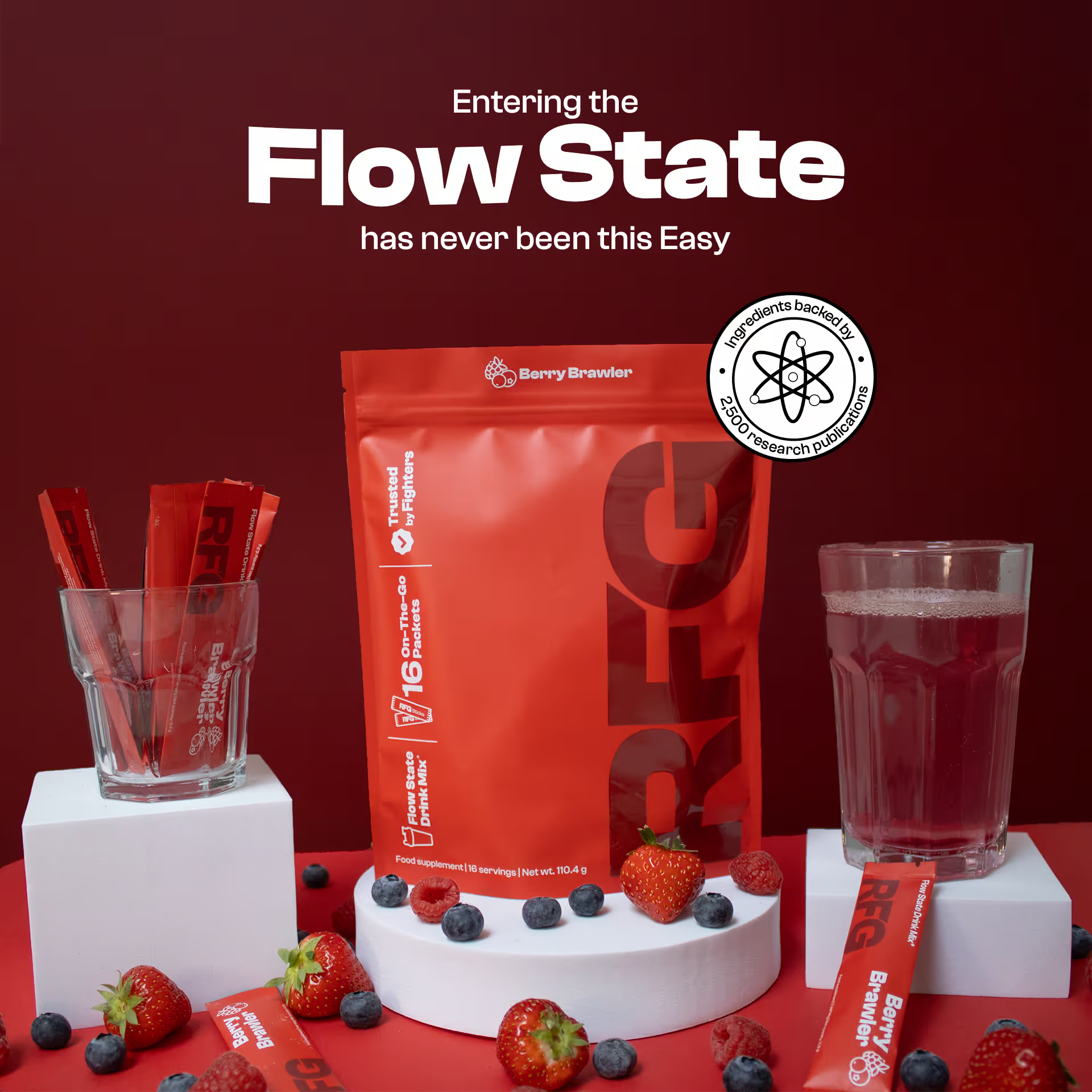 RFG Berry Brawler pouch displayed with mixed berries, on-the-go sticks, and a glass of mixed drink, highlighting the flow state formula trusted by fighters.