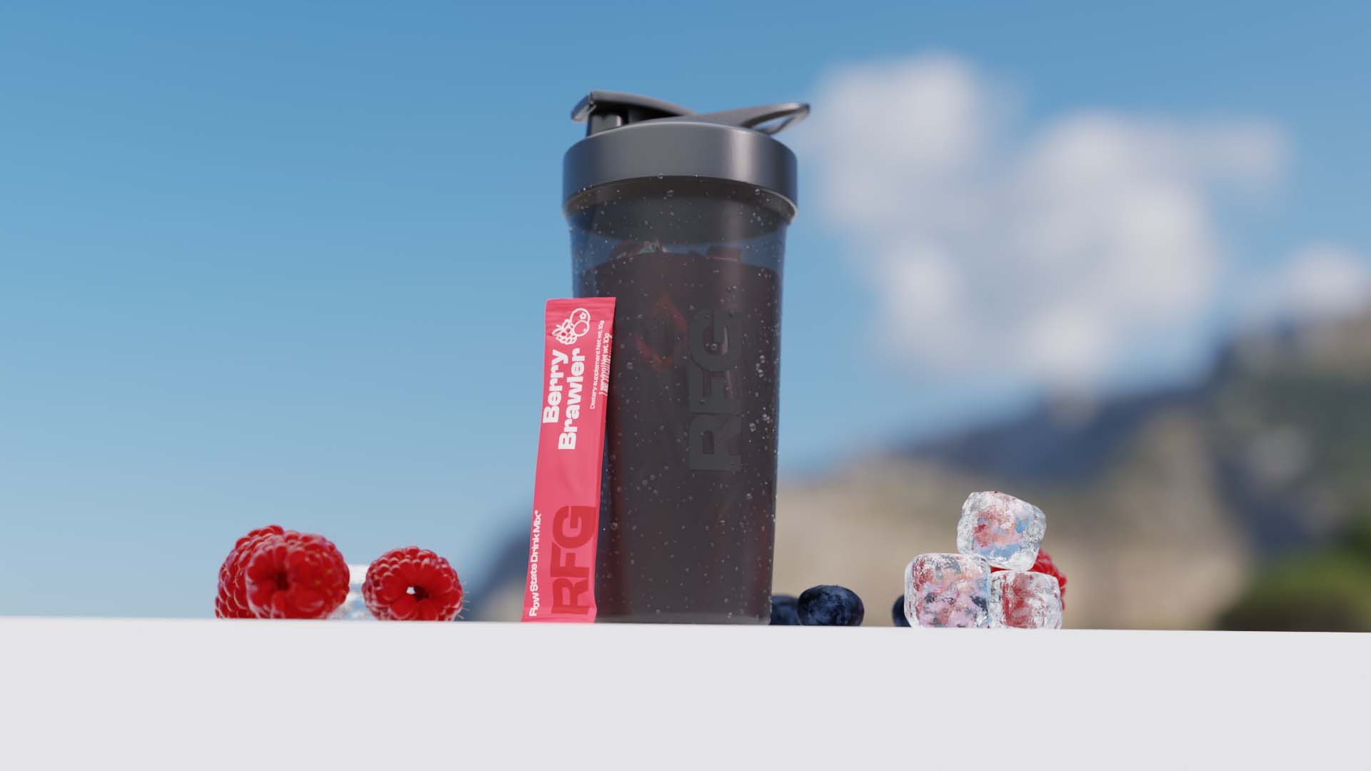 RFG shaker standing up right on a white platform, laying on it is a RFG stick next to ice cubes and blueberries, behind is a outdoor background blured.